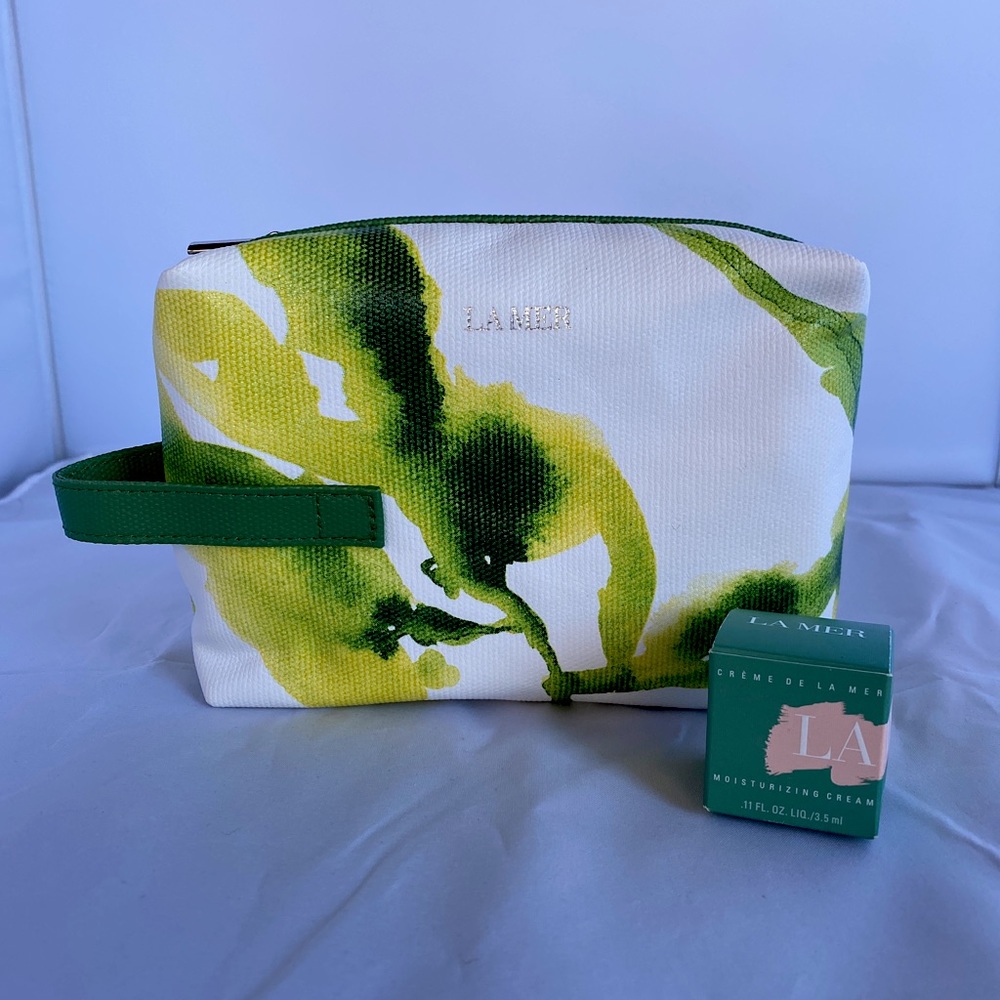 La Mer travel bag with travel size of moisturizing cream .11 fl oz